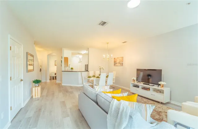 a living room with furniture and a table