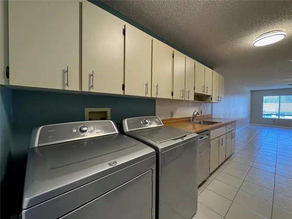 a kitchen with a stove and a sink