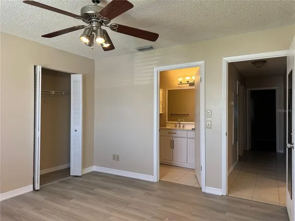 a view of an empty room with a bathroom