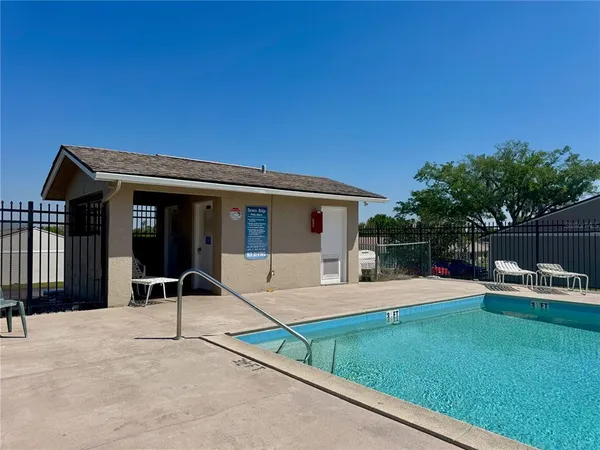 a house view with a sitting space and garden