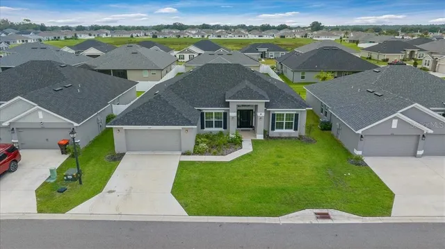 an aerial view of a house with a garden view