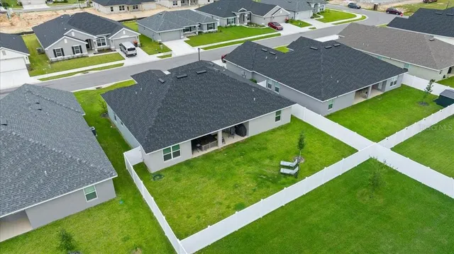 a front view of house with a garden