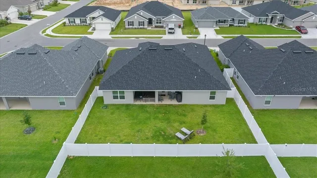 a view of an house with backyard space and garden