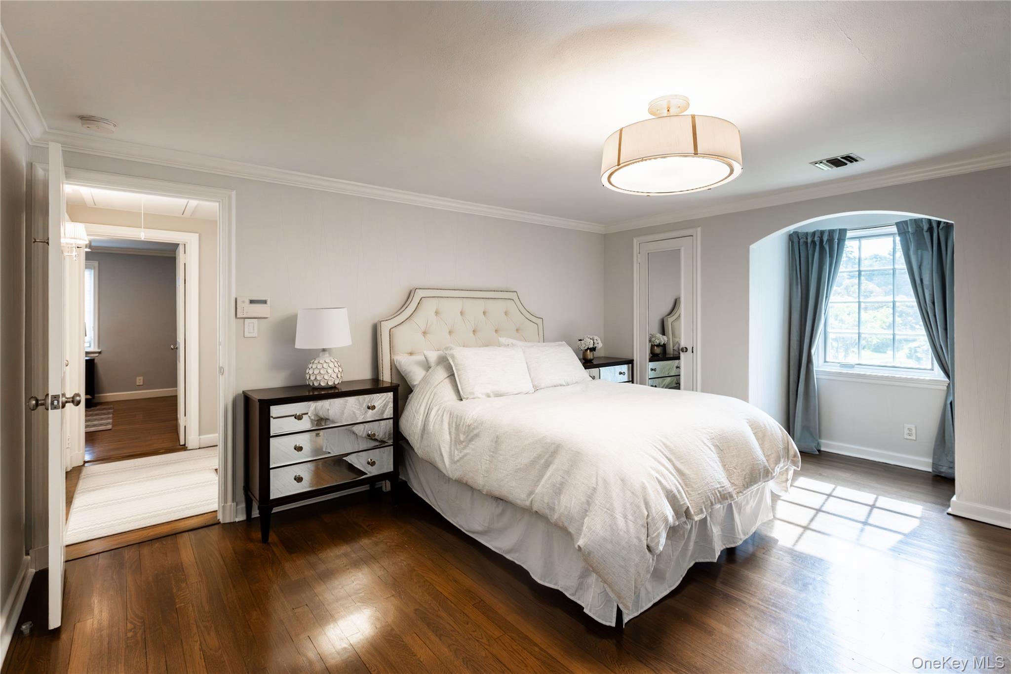 20 Mill Spring Road Manhasset, NY 11030 - Photo 11 of 17 a bedroom with a bed and a large window