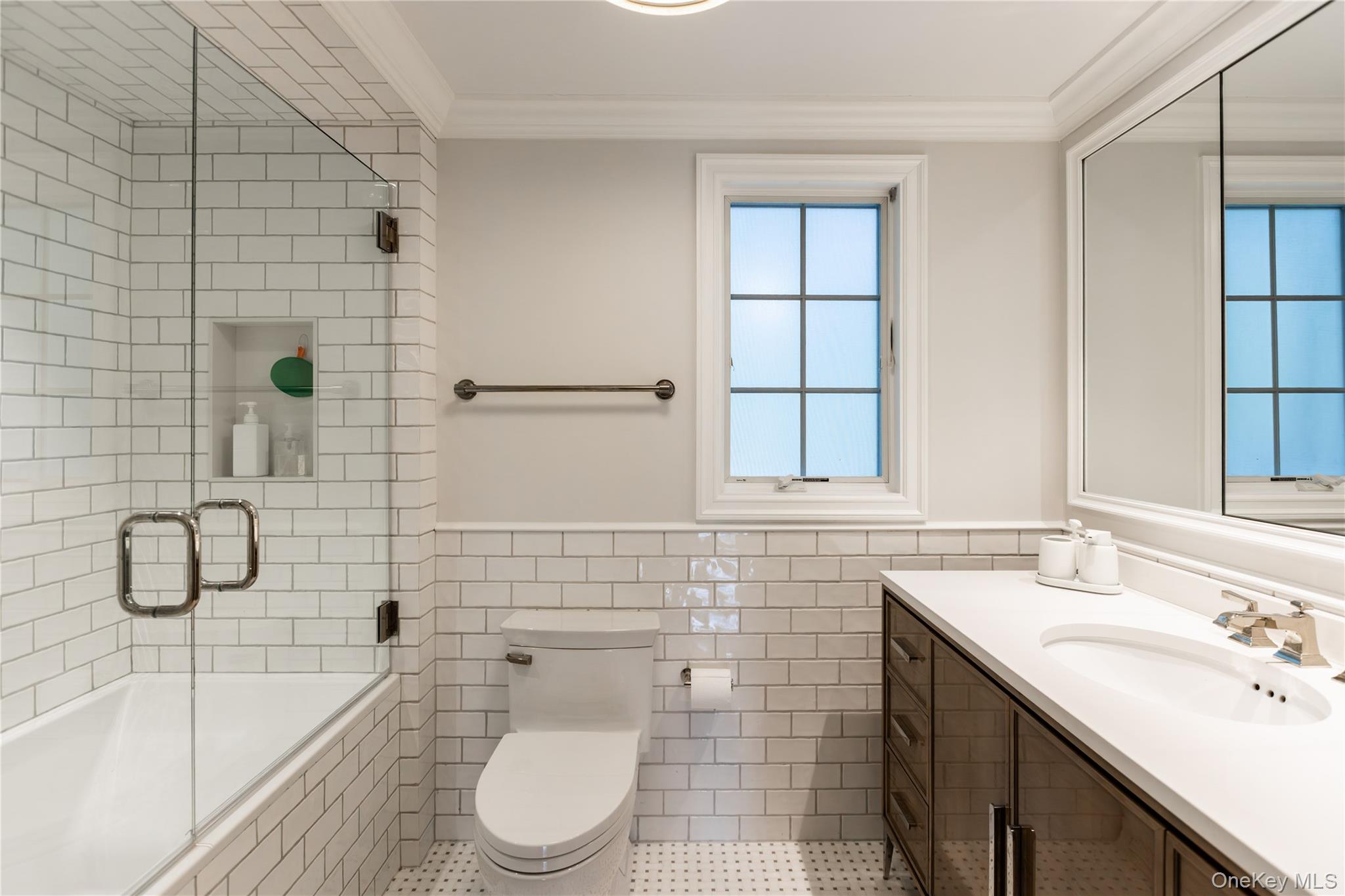 20 Mill Spring Road Manhasset, NY 11030 - Photo 12 of 17 a bathroom with a sink toilet and shower