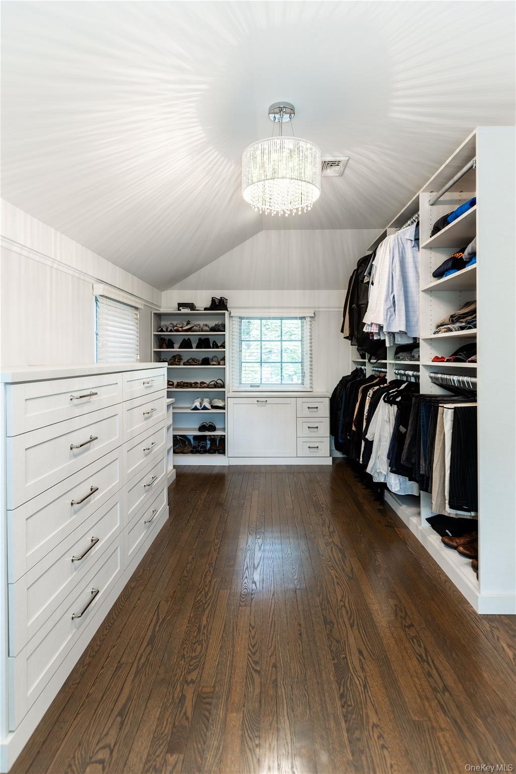 20 Mill Spring Road Manhasset, NY 11030 - Photo 13 of 17 a view of walk in closet with clothes and shoes