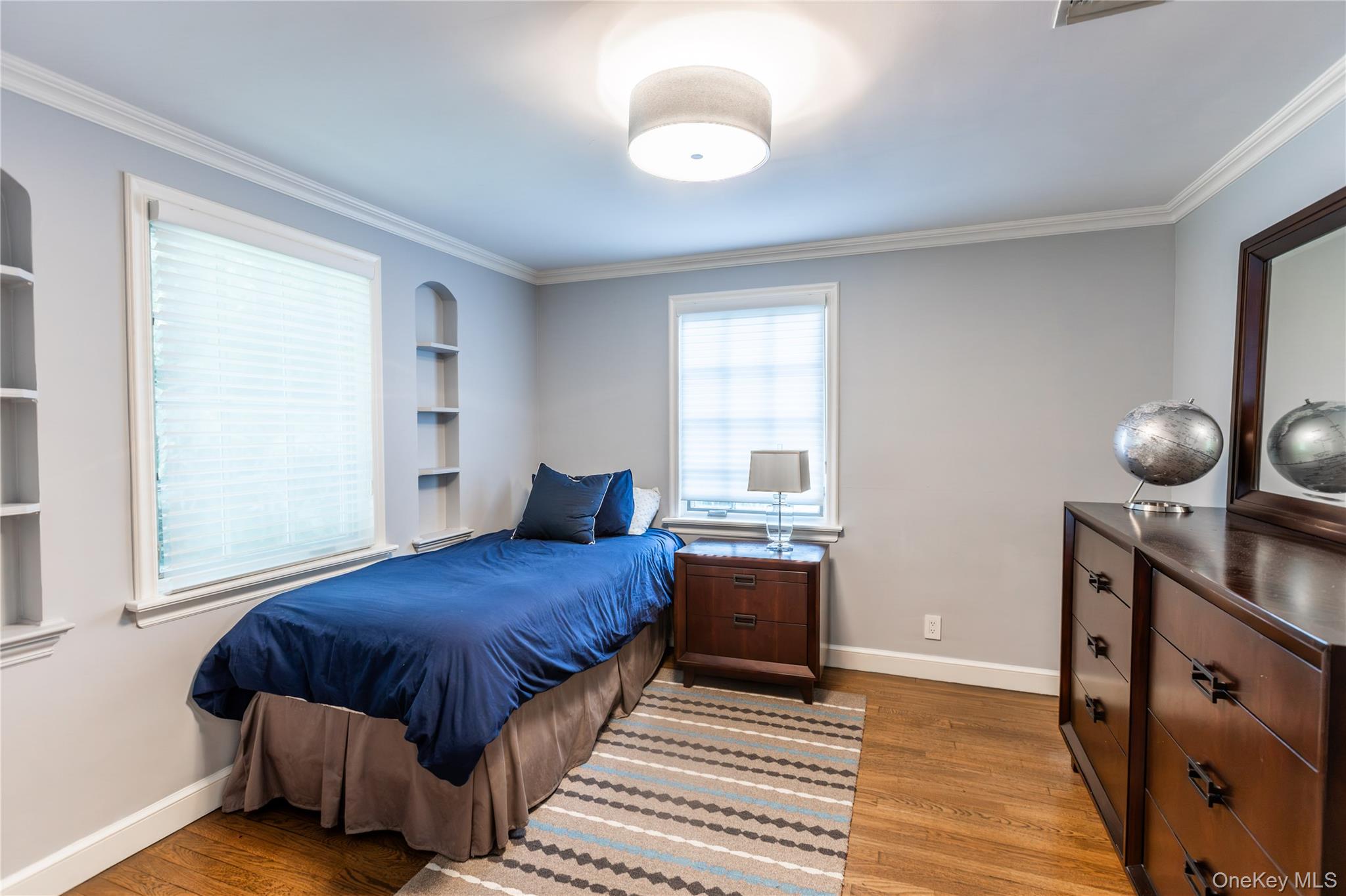 20 Mill Spring Road Manhasset, NY 11030 - Photo 16 of 17 a bedroom with a bed and window