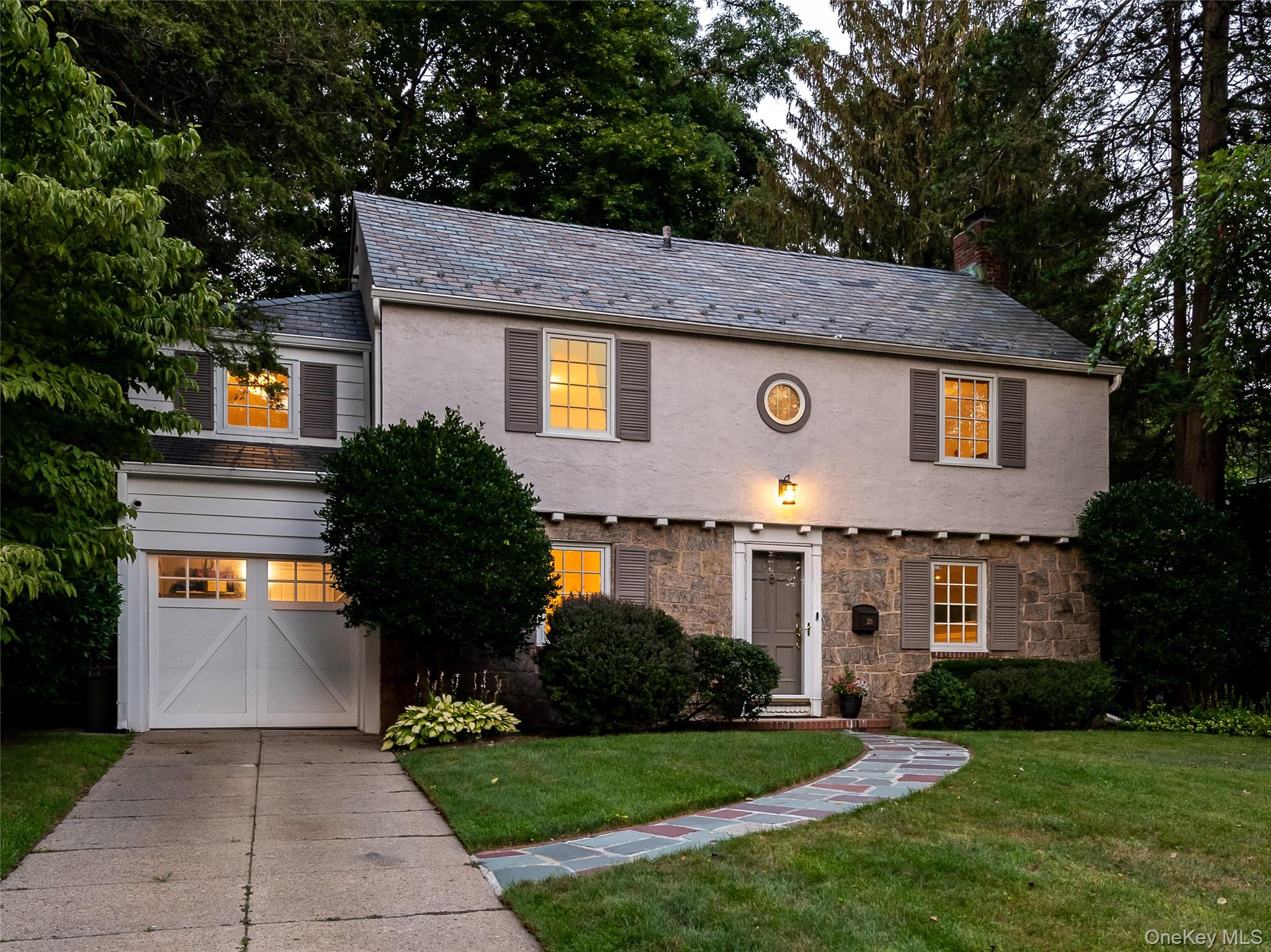 20 Mill Spring Road Manhasset, NY 11030 - Photo 2 of 17 a front view of a house with garden