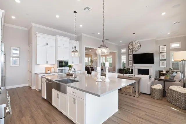 a large kitchen with stainless steel appliances