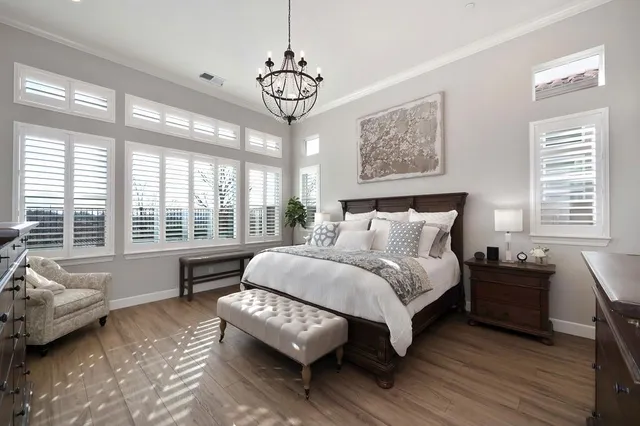 a spacious bedroom with a bed and a couch