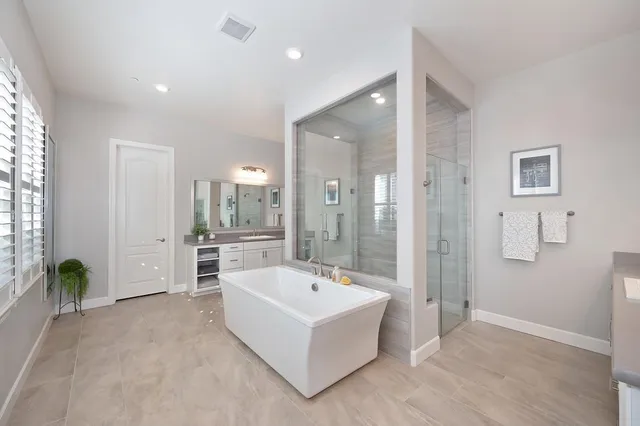a bathroom with a bathtub and a shower