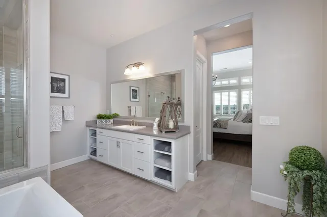 a room with a bed and a mirror