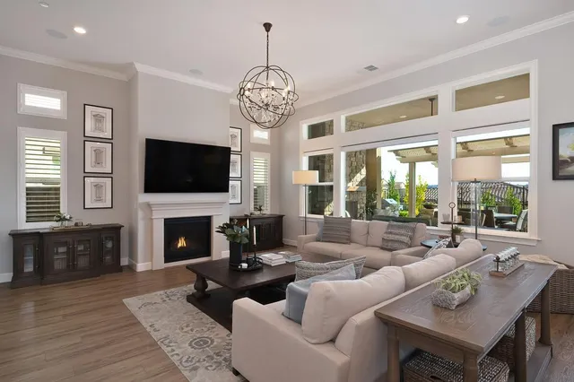 a living room with fireplace furniture and a flat screen tv