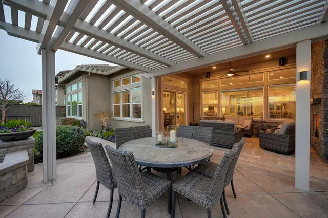 a dining room with furniture and wooden floor