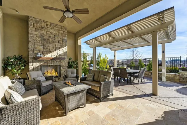 a view of a patio with a table chairs and backyard