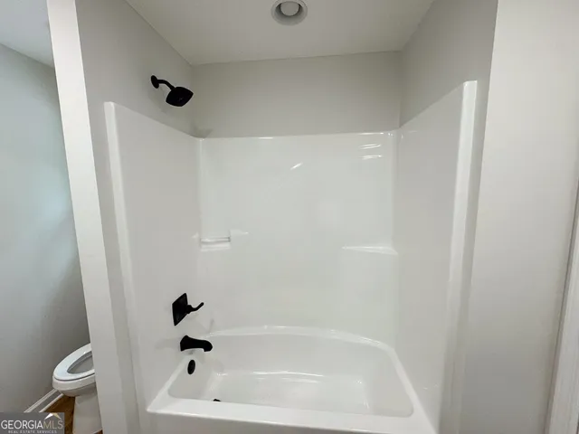 a bathroom with a bathtub