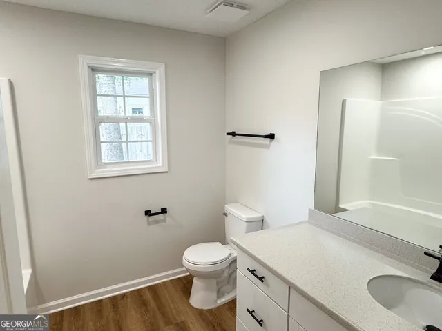 a bathroom with bathtub and shower
