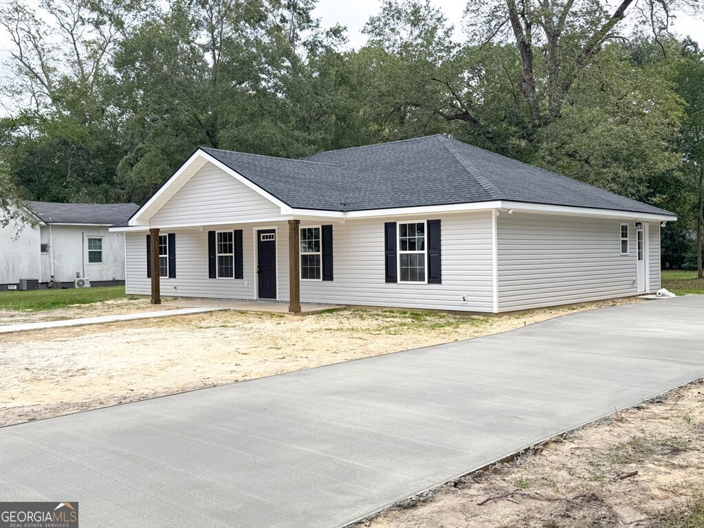 808 Satilla Boulevard Waycross, GA 31501 - Photo 26 of 29 a front view of a house with a yard and garage