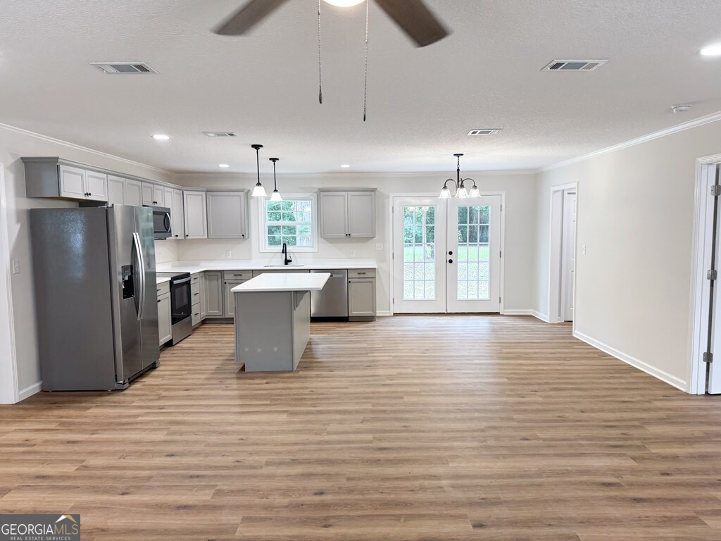 808 Satilla Boulevard Waycross, GA 31501 - Photo 3 of 29 a kitchen with stainless steel appliances granite countertop a refrigerator a sink dishwasher a stove and a refrigerator