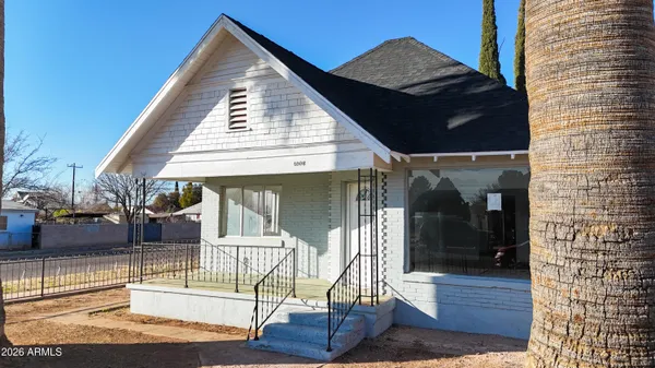 a view of house with wooden floor and outdoor seating
