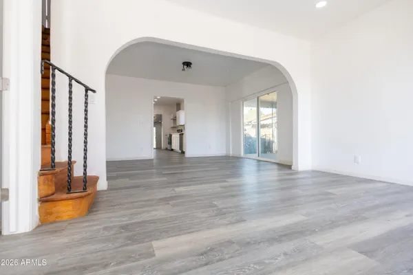 a view of a room with wooden floor