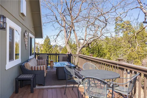 a view of a chairs and table on the deck