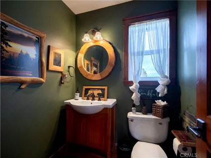 a bedroom with a bed and a view of bathroom