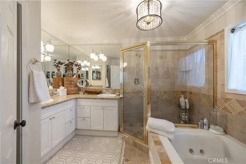 a bedroom with a large bed and a large window