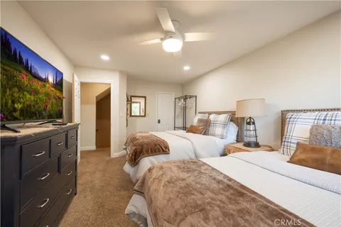 a room with kitchen island a sink a stove and a refrigerator