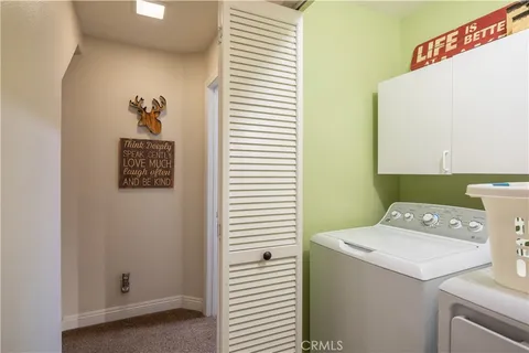 a room with pool table and windows