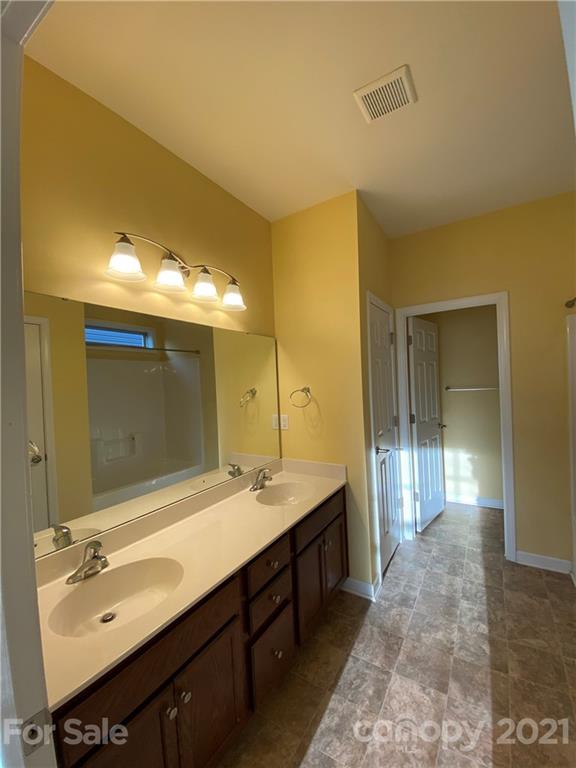 12 South River Road Fletcher, NC 28732 - Photo 12 of 21 a bathroom with a double vanity sink and a mirror