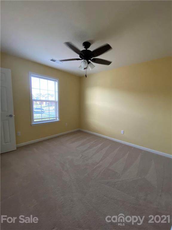 12 South River Road Fletcher, NC 28732 - Photo 16 of 21 an empty room with windows and fan