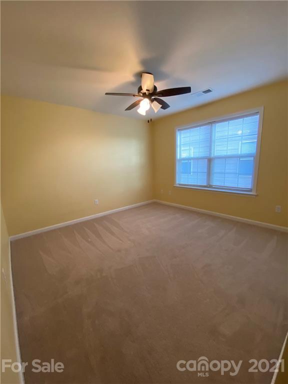 12 South River Road Fletcher, NC 28732 - Photo 20 of 21 an empty room with windows and fan
