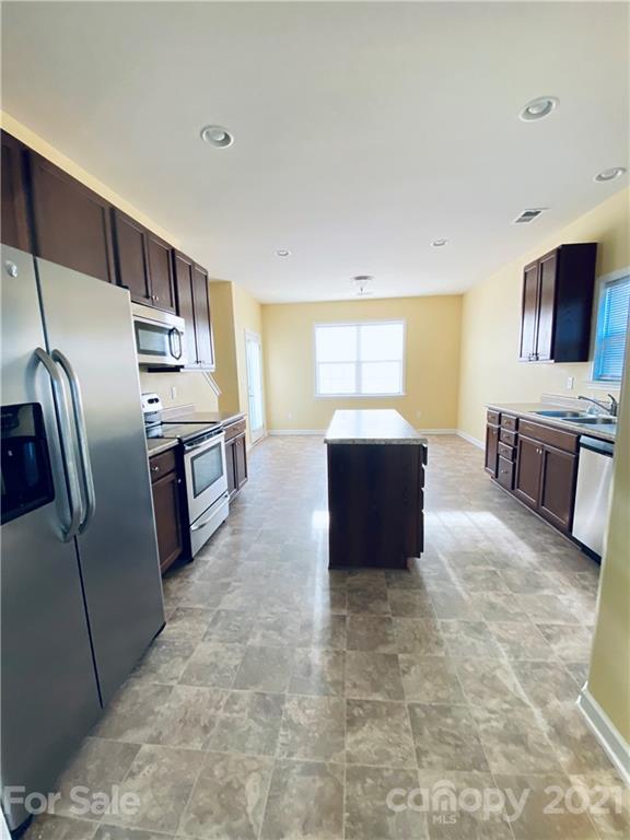 12 South River Road Fletcher, NC 28732 - Photo 6 of 21 a kitchen with stainless steel appliances granite countertop a refrigerator and a stove