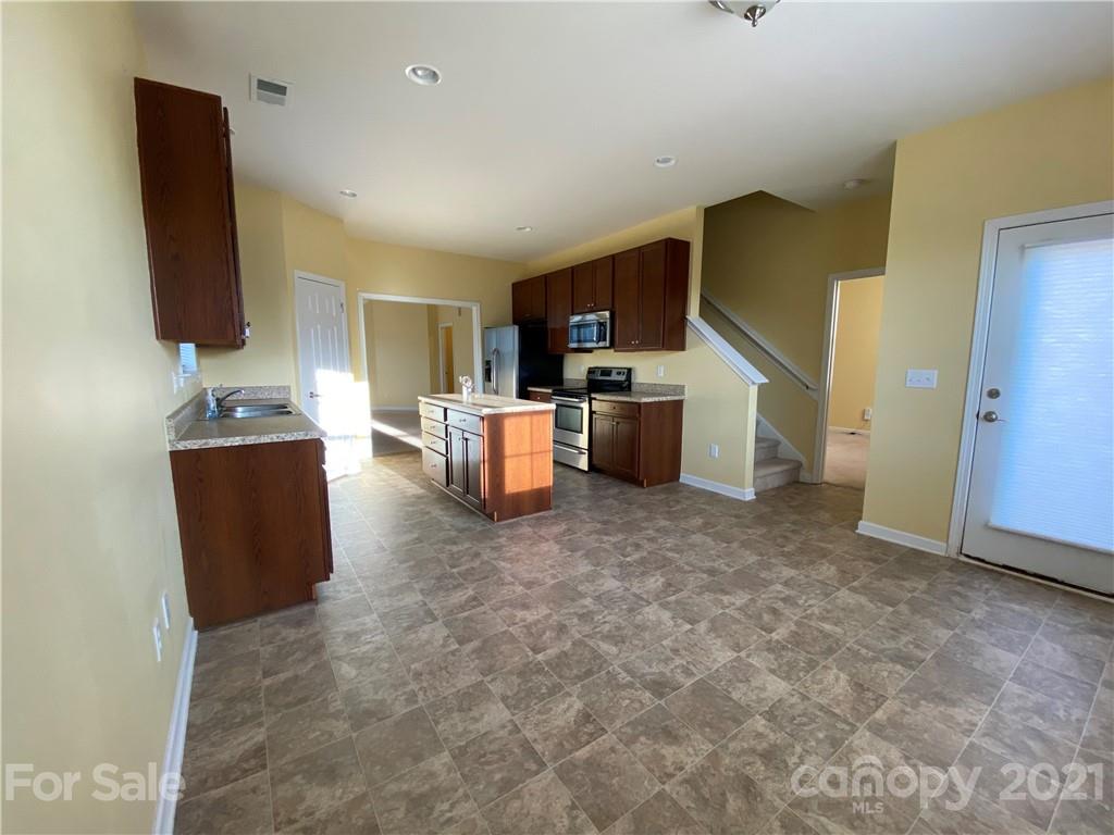 12 South River Road Fletcher, NC 28732 - Photo 7 of 21 a living room with furniture and a flat screen tv