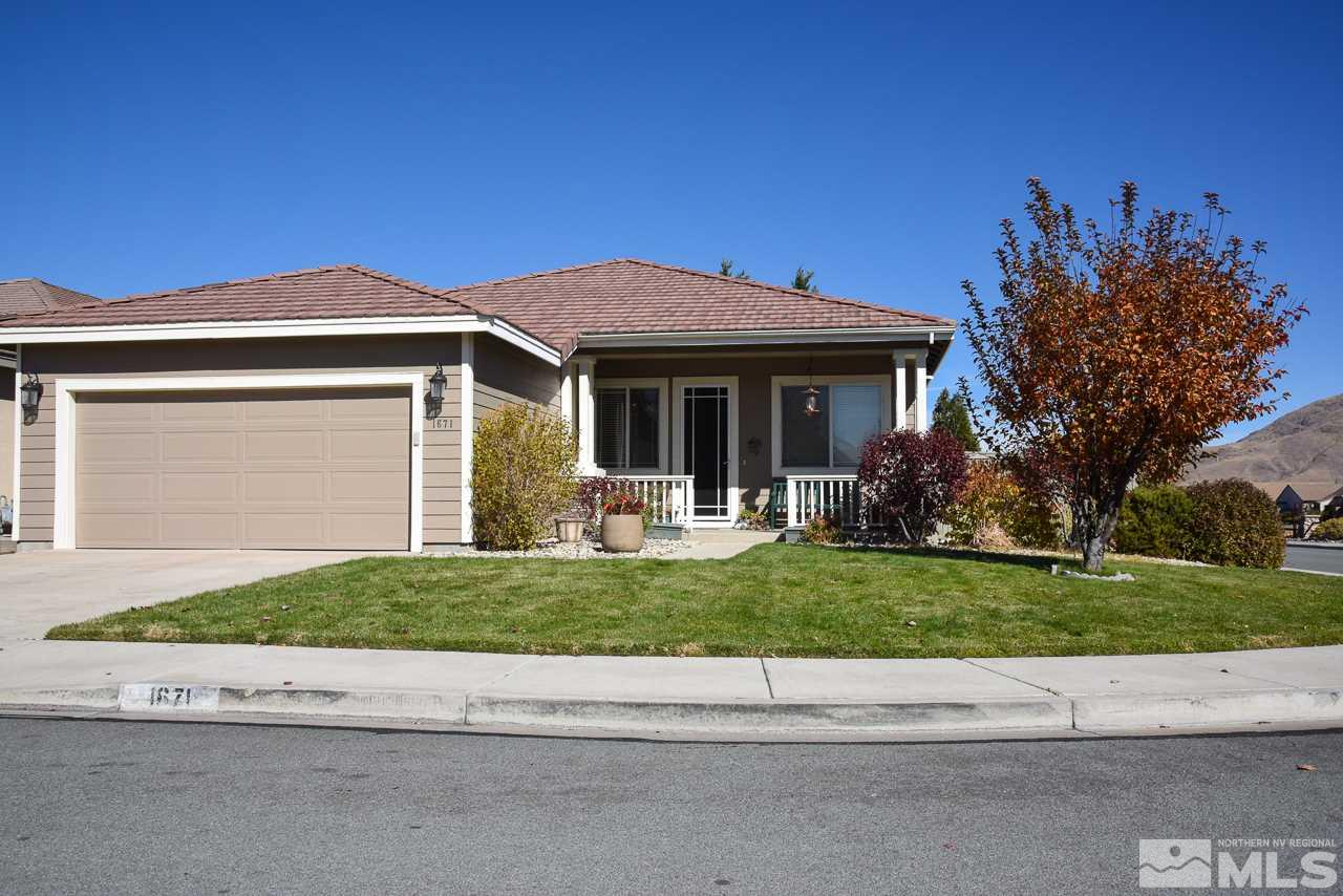 1671 Brentworth Way Reno, NV 89521 - Photo 1 of 1 a front view of a house with a yard and trees