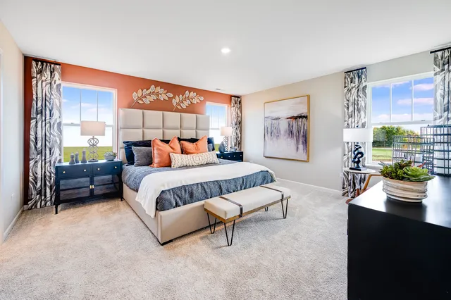 a bedroom with furniture and a window