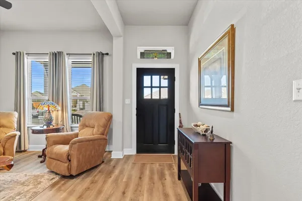a living room with furniture and entry gate