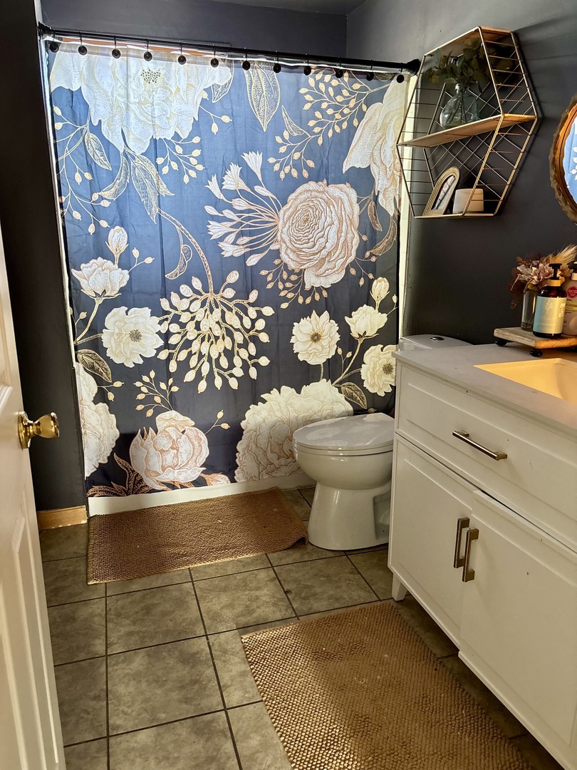 3330 Airport Road LaSalle, IL 61301 - Photo 7 of 15 a bathroom with a toilet and a shower curtain