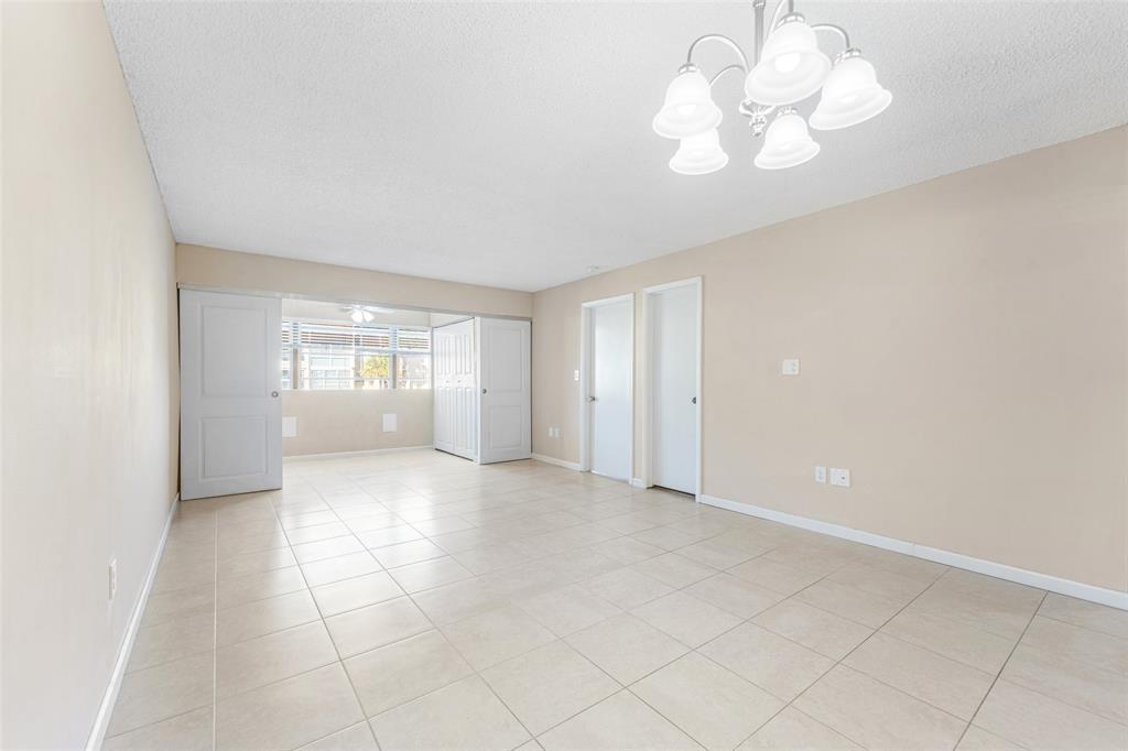 2720 North Pine Island Road, Unit 212 Sunrise, FL 33322 - Photo 5 of 49 LARGE LIVING AND DINING AREA TILE THROUGHOUT
