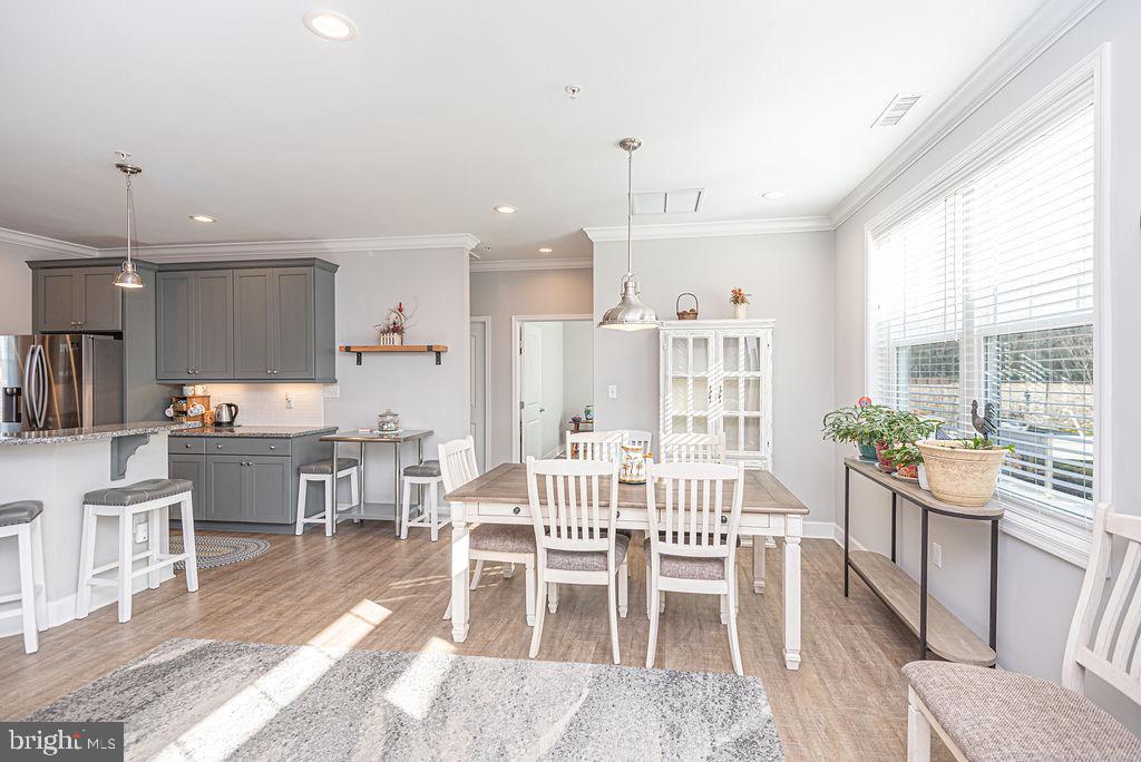 11910 Back Creek Road Bishopville, MD 21813 - Photo 11 of 94 a view of a dining room with furniture window and wooden floor