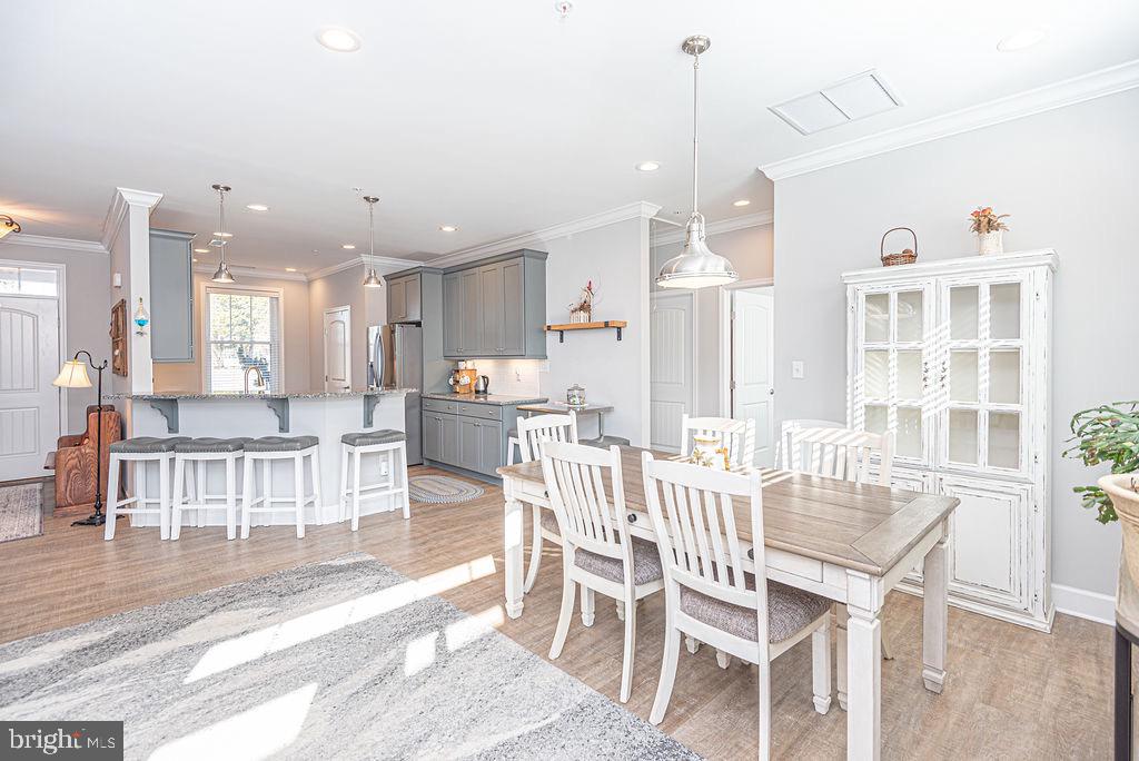 11910 Back Creek Road Bishopville, MD 21813 - Photo 94 of 94 a dining room with furniture and a view of kitchen