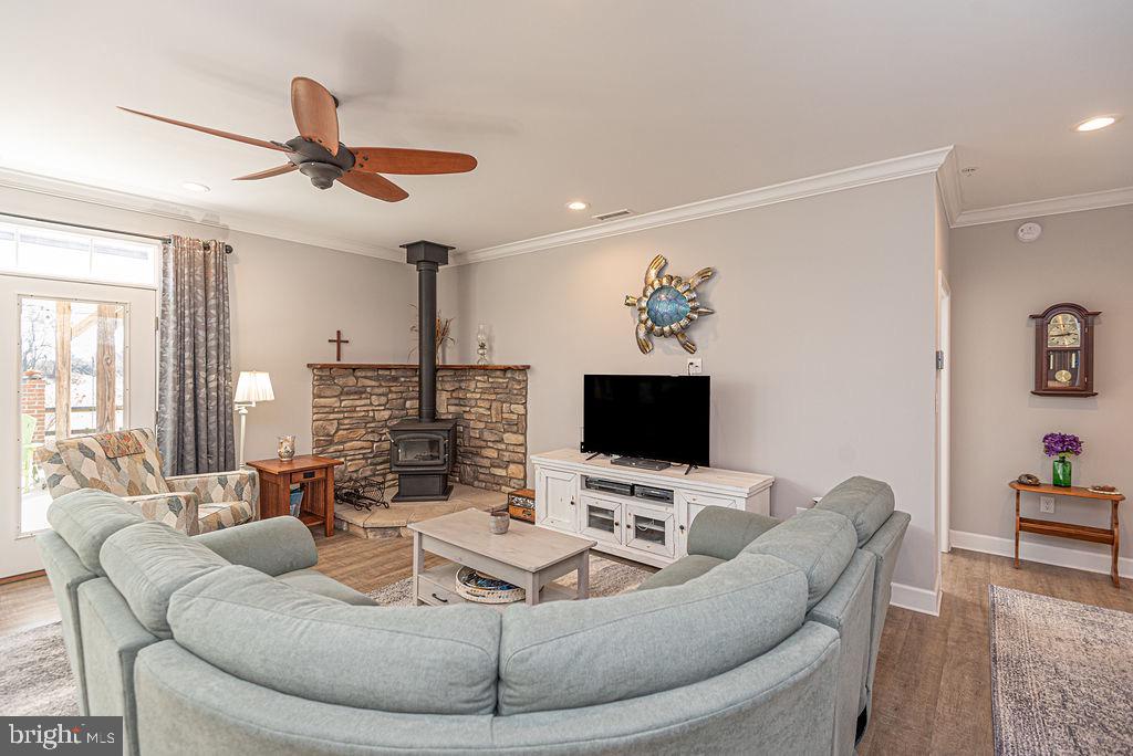 11910 Back Creek Road Bishopville, MD 21813 - Photo 18 of 94 a living room with furniture and a flat screen tv