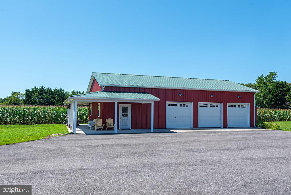 11910 Back Creek Road Bishopville, MD 21813 - Photo 2 of 94 a front view of a house with a yard