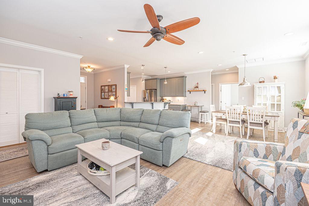 11910 Back Creek Road Bishopville, MD 21813 - Photo 22 of 94 a living room with furniture kitchen view and a large window