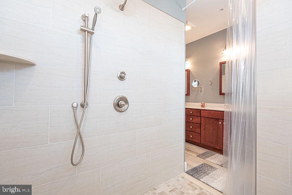 11910 Back Creek Road Bishopville, MD 21813 - Photo 33 of 94 a bathroom with a shower and a sink