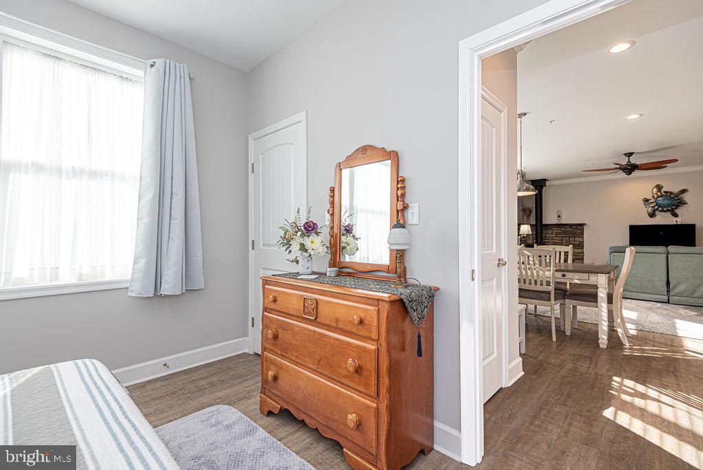 11910 Back Creek Road Bishopville, MD 21813 - Photo 39 of 94 a view of a dining room with furniture and a window