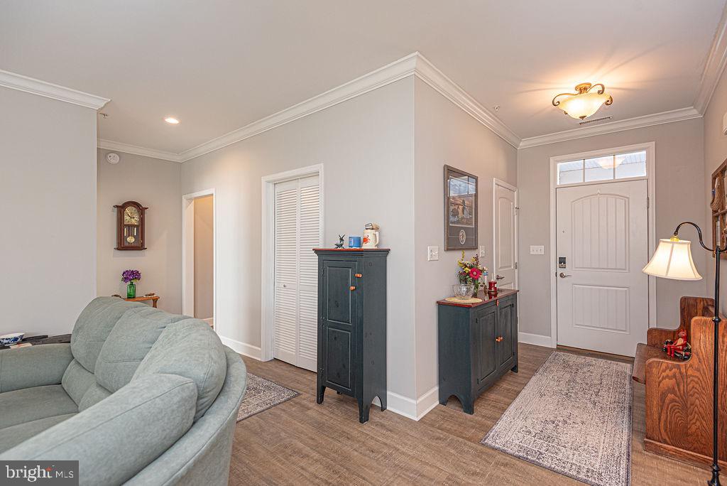11910 Back Creek Road Bishopville, MD 21813 - Photo 45 of 94 a living room with furniture and a wooden floor