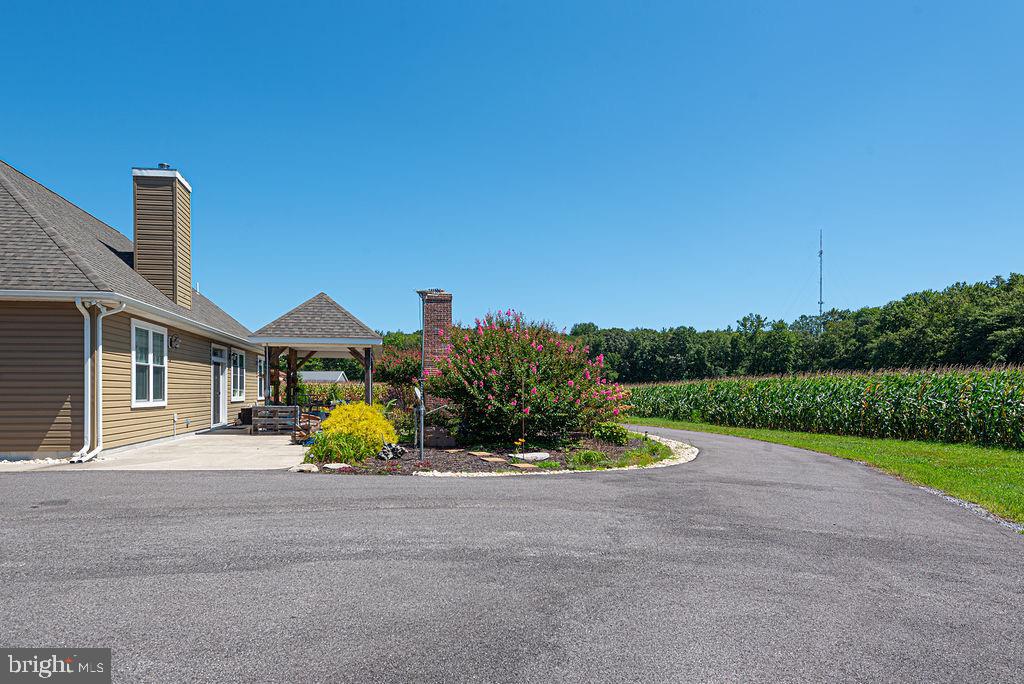 11910 Back Creek Road Bishopville, MD 21813 - Photo 61 of 94 a view of a house with a yard and sitting area