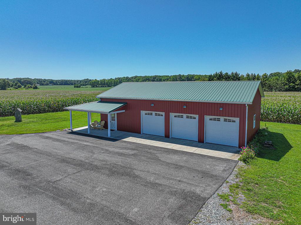 11910 Back Creek Road Bishopville, MD 21813 - Photo 85 of 94 a front view of a house with a yard and garage